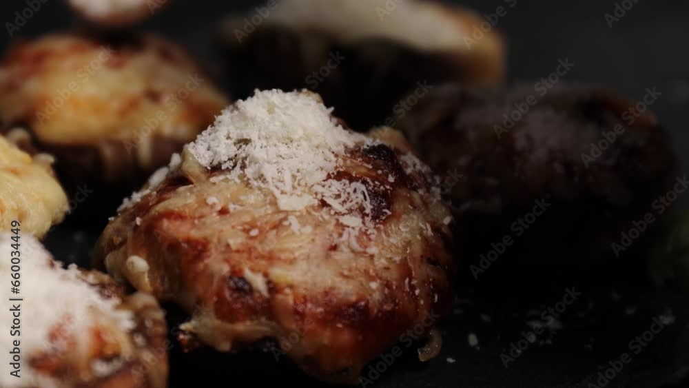 Place parmesan stuffed mushrooms on a stone board. a step by step stuffed mushrooms recipe. Sprinkle with grated parmesan cheese and lay out a fresh basil leaf. Place parmesan stuffed mushrooms on a stone board. a step by step stuffed mushrooms recipe. Sprinkle with grated parmesan cheese and lay out a fresh basil leaf.