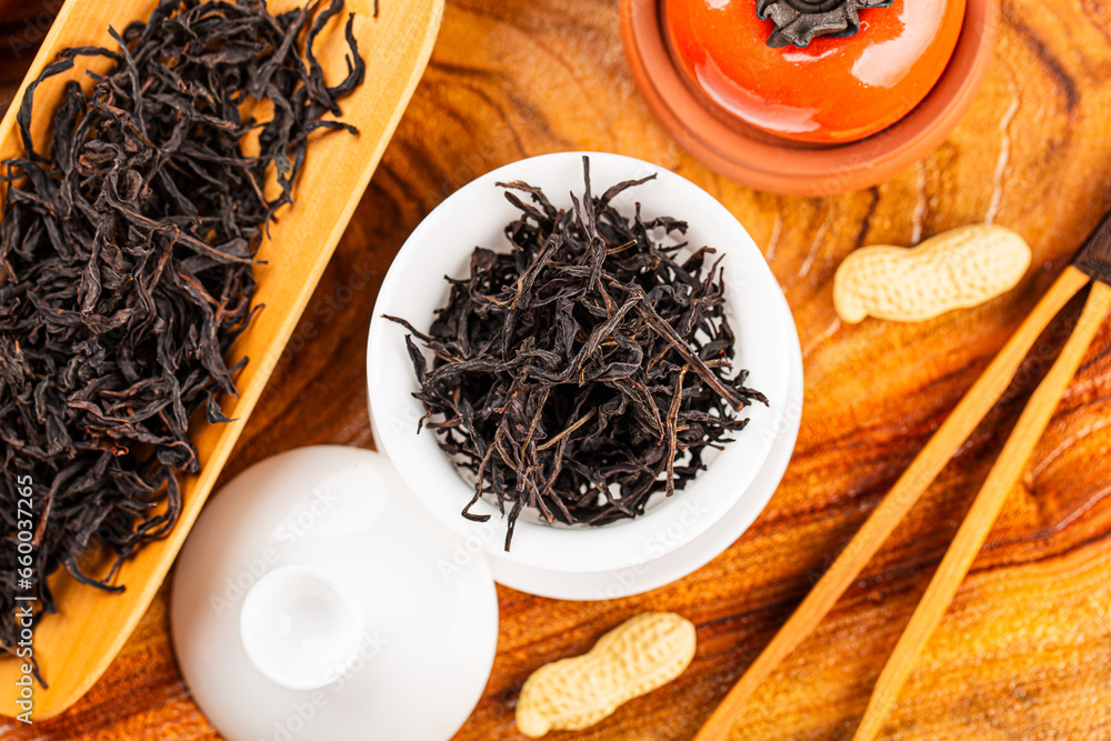 Fototapeta premium Brewing Chinese tea in ceramic gaiwan during the tea ceremony close-up.