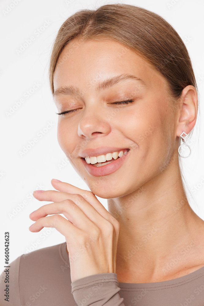 Beautiful young girl with fresh healthy skin. Woman advertise ear-rings. White background. Earrings, ear caffs closeup. Blond european woman with long hair with big lips, pretty smile. Cosmetology Beautiful young girl with fresh healthy skin. Woman advertise ear-rings. White background. Earrings, ear caffs closeup. Blond european woman with long hair with big lips, pretty smile. Cosmetology
