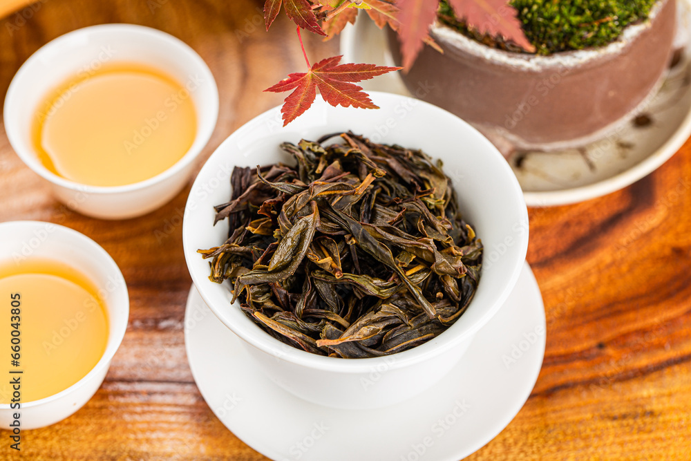 Fototapeta premium Brewing Chinese tea in ceramic gaiwan during the tea ceremony close-up.