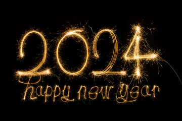 Happy New Year 2024. Sparkling burning text Happy New Year 2024 isolated on black background.