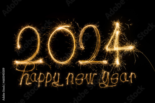 Happy New Year 2024. Sparkling burning text Happy New Year 2024 isolated on black background. photo
