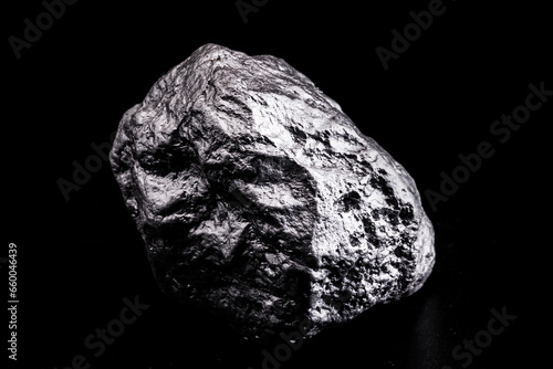 large silver stone, rare silver nugget on black background. Gemstone in high resolution, luxury concept.