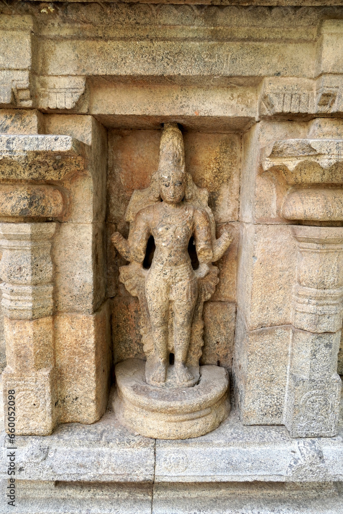 Ancient Hindu God statue in temple. Stone carving of historic God sculpture in Airavatesvara Temple in Darasuram, Kumbakonam, Tamilnadu.