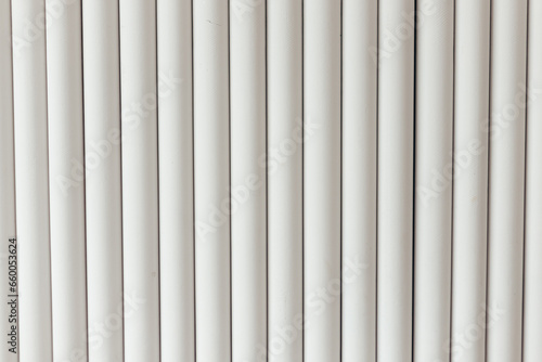 White Vertical lines tubes, wall decoration background. Interior design