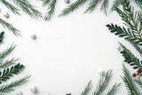 Christmas ornaments and evergreen branches on a white background