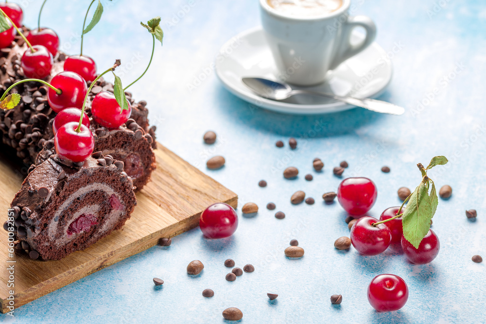 Chocolate roll cake with cream and cherries.
