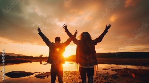 Happy young couple dancing on beach at beautiful sunset. Travel and vacation concept