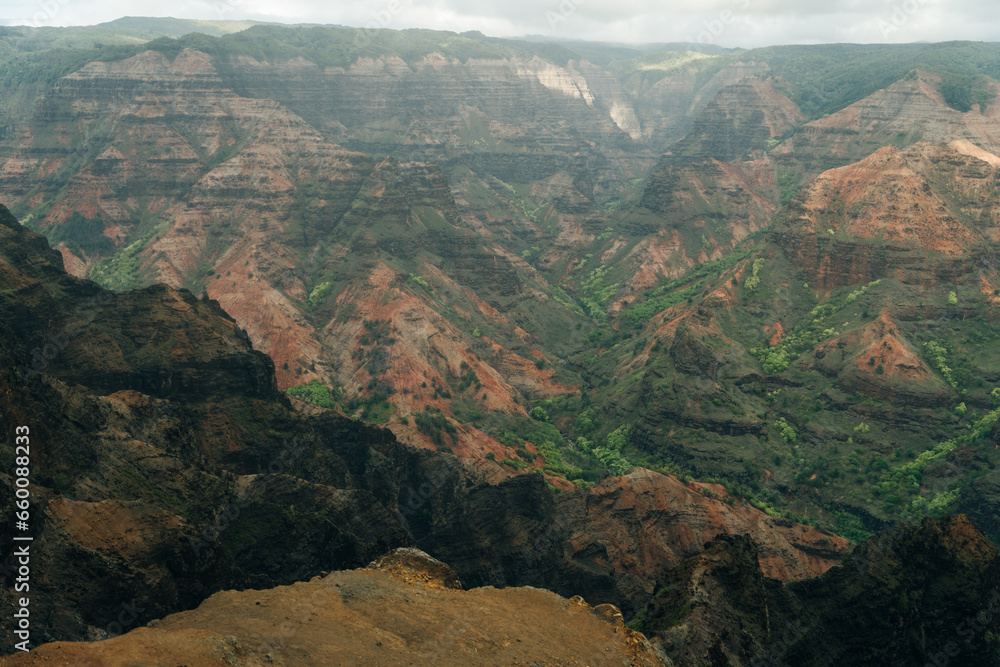 Canyon Lookout is a poplar area for visitors to Kauai's colorful canyon. kauai, hawaii - sep 2022