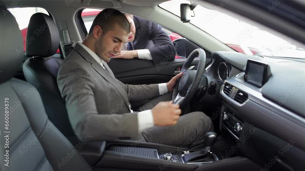 Young man sitting in car Young man sitting in car