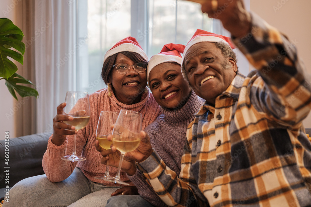 Family toasting at Christmas and taking a selfie to share with the rest of the family. Concept: happiness, special days