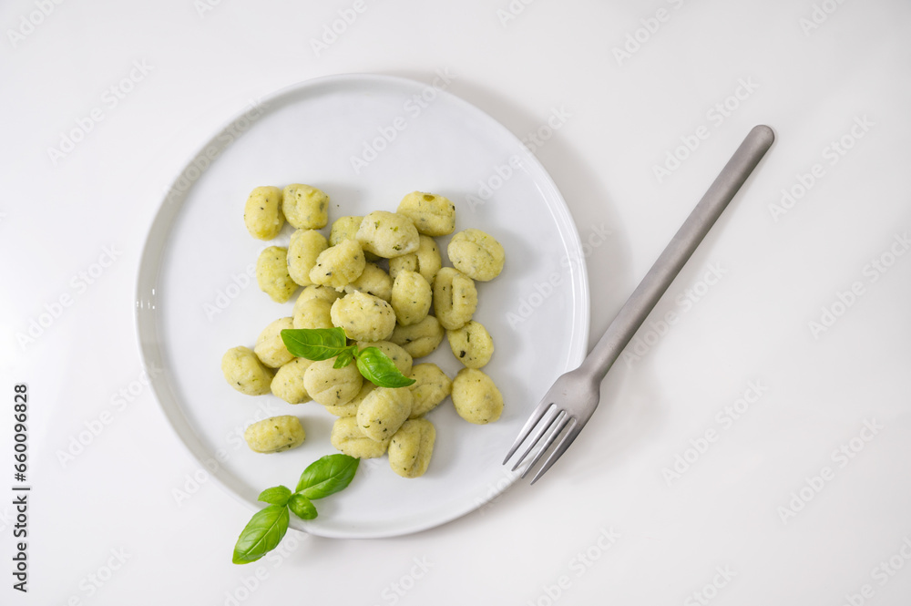 Italian gnocchi. Traditional Italian food. Handmade potato balls with parmesan and basil. Food for vegetarians and lovers of Italian typical cuisine. homemade pasta . High quality Italian gnocchi. Traditional Italian food. Handmade potato balls with parmesan and basil. Food for vegetarians and lovers of Italian typical cuisine. homemade pasta . High quality
