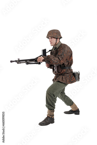 Male actor in the uniform of a German army soldier during World War II with a machine gun