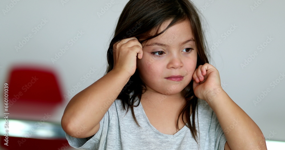 Tired little girl rubbing eyes with hands Tired little girl rubbing eyes with hands