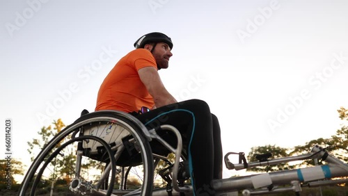 disabled paraplegic man in racing wheelchair resting after training, professional paralympic athlete