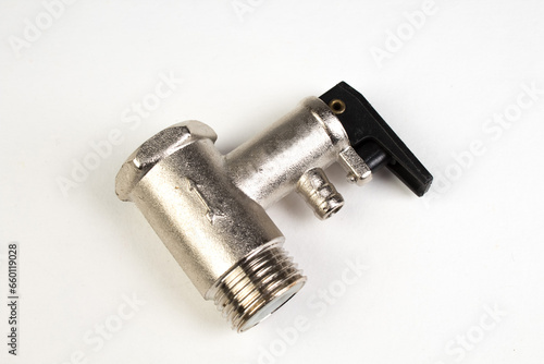 water valves, used inboiler water systems. Shiny metal, shiny texture on white background. Bathroom. Top view. photo