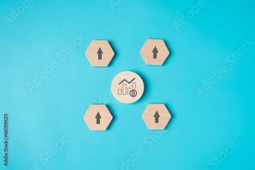 Fototapeta Naklejka Na Ścianę i Meble -  Graph goal icons on wooden blocks for successful business investment, Strategy planning management, Progress of business and analyzing financial investment data, Business development
