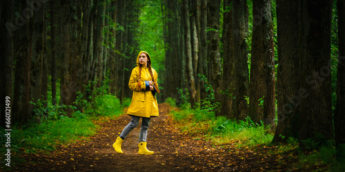 Woman in yellow raincoat photo