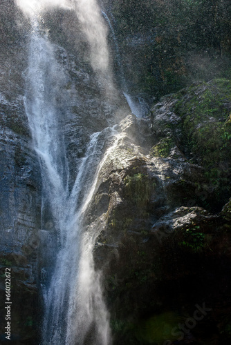 Water splashing against rocks in sunlit waterfall in Minas Gerais  Brazil