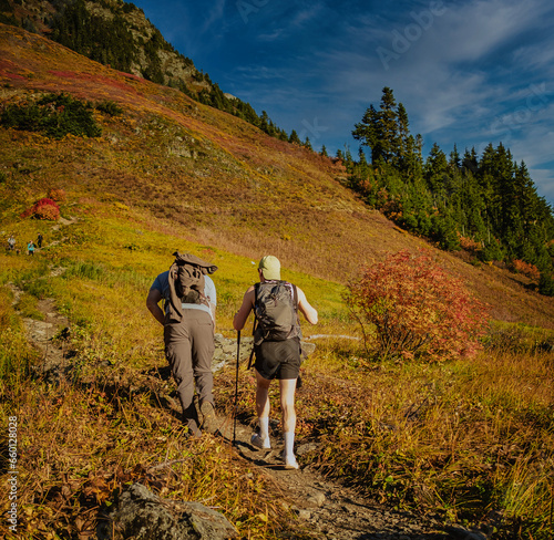 Two hikers on the trail on the mount Cheam. Hikers with backpacks climbing the mountain. © Elena_Alex