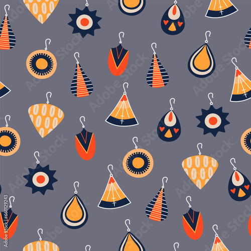 Seamless pattern with female vintage earrings. Boho style accessories on blue background. Vector illustration