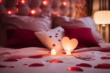Romantic bed with pillows, rose petals and a candle. Valentine's Day.
