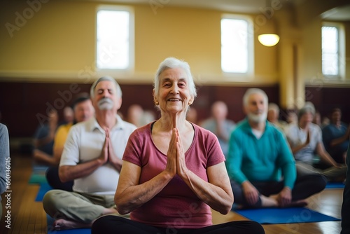 elderly woman practicing yoga pose in studio