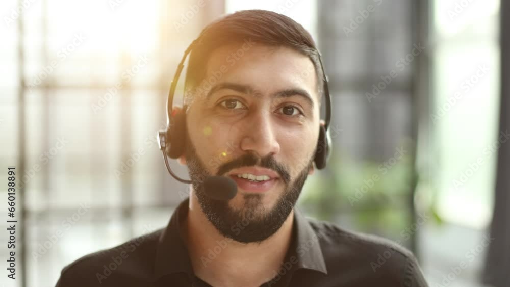 Portrait of an attractive businessman working in a call center Portrait of an attractive businessman working in a call center