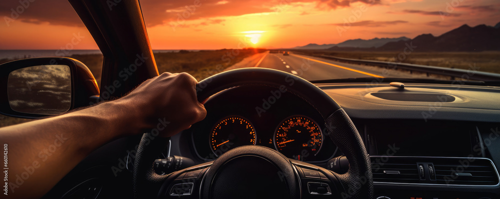 Obraz premium Hands of car driver on steering wheel