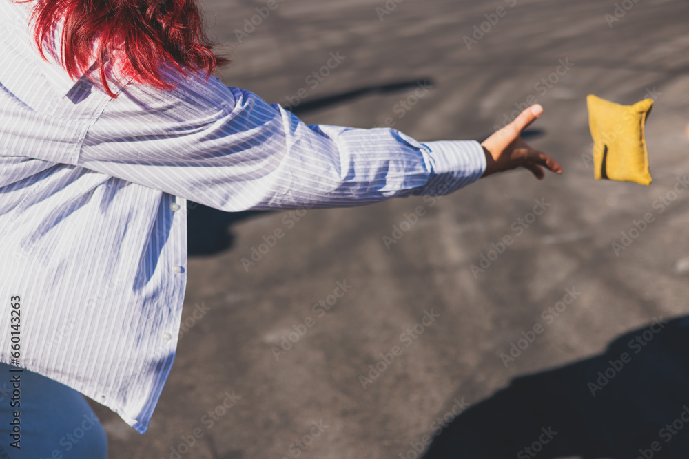 Cornhole game set, process of throwing bean bags, kids children tossing ...