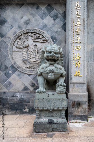 stone lion statue in front of the palace