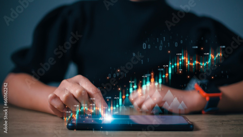 Women analyze trading data on the futuristic virtual interface screens. smartphone with a stock exchange graph on the screen. Financial stock market.