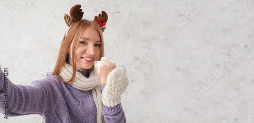 Young woman with reindeer a...