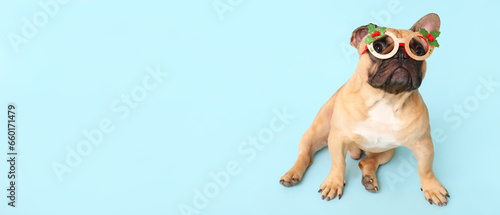 Cute dog with Christmas glasses on light background with space for text © Pixel-Shot