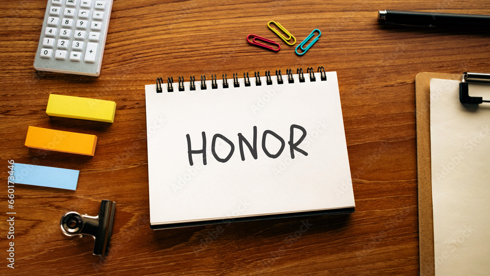 There is notebook with the word HONOR. It is as an eye-catching image. There is notebook with the word HONOR. It is as an eye-catching image.