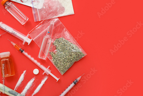 Composition with different drugs and syringes on red background
