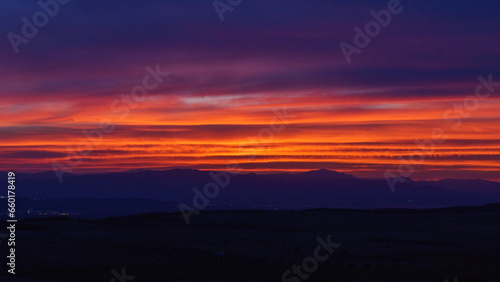 Sunset with colorful sky over mountain landscape near Bardenas Reales Arguedas, Navarra, Spain © Sebastian
