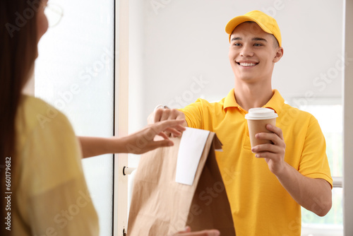Young courier delivering fo...