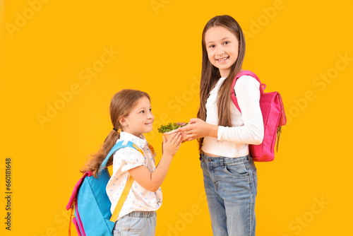 Happy girls with backpacks ...