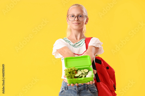 Happy girl in eyeglasses wi...