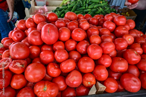 Tomatoes on the stall. Fresh, tasty and ripe tomatoes for sale at the market. © Ajdin Kamber