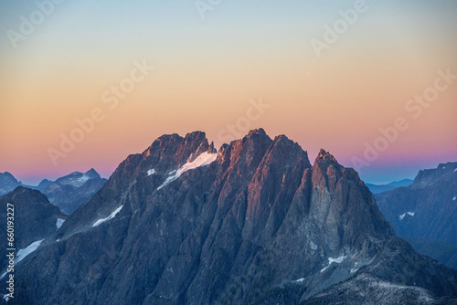 Sunrise Reaching Mountain peak © robert
