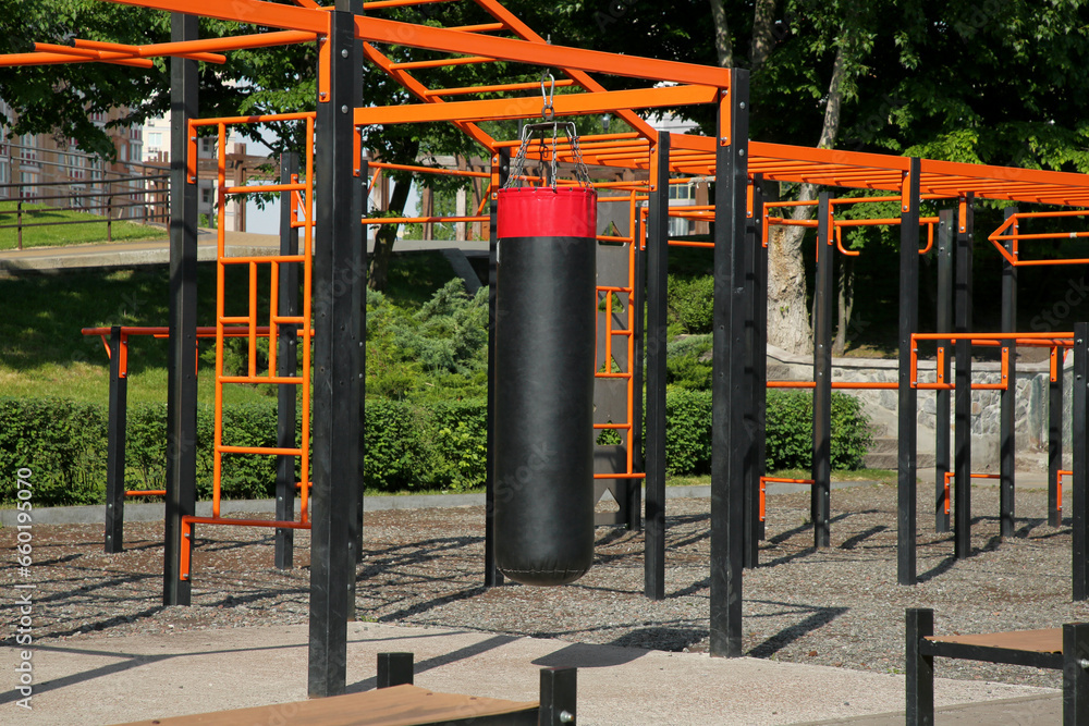 Empty outdoor gym with exercise equipment in park Empty outdoor gym with exercise equipment in park