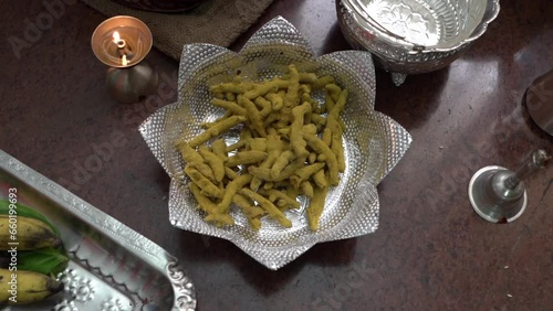 Turmeric sticks on a silver plate during an india tradition photo