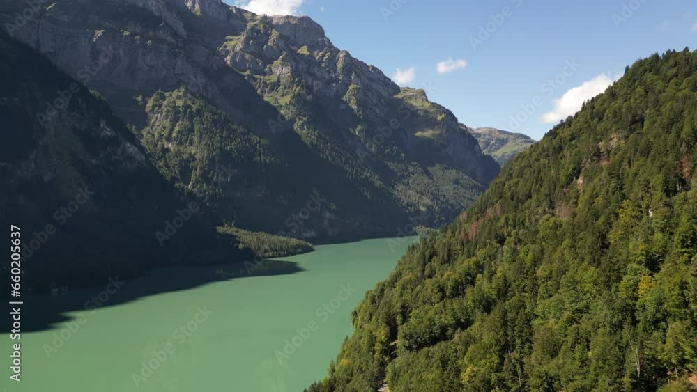 Majestic Peaks, Crystal Waters: Aerial view of green forest and Lakeside Mountains Majestic Peaks, Crystal Waters: Aerial view of green forest and Lakeside Mountains