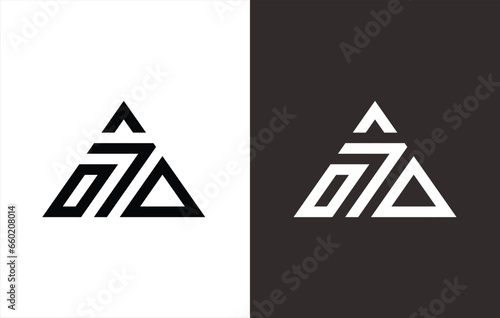 monogram logo in the shape of a triangle that forms the number 7. Black and white background. photo