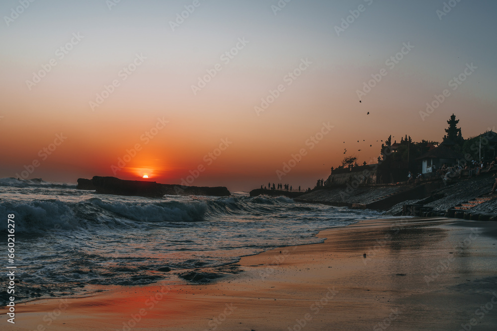 sunset in the Canggu beach,silhouette of bali temple