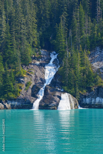 Waterfall of ice water flowing in the Pacific Ocean in the Tracy Arm Fjord near Juneau in southeastern Alaska  USA