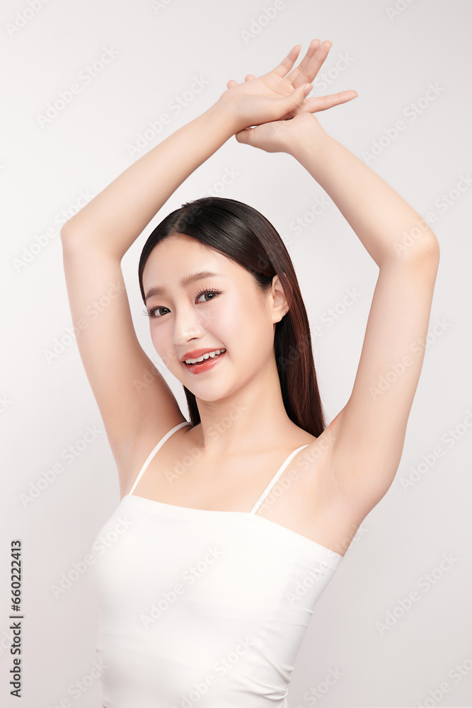Beautiful Young Asian woman lifting hands up to show off clean and