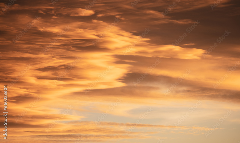 Swirling Peach Clouds Cover Sky at Sunset